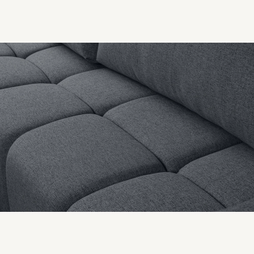 Fumo Komfortowa sofa narożna pikowana Tkanina Neve 97